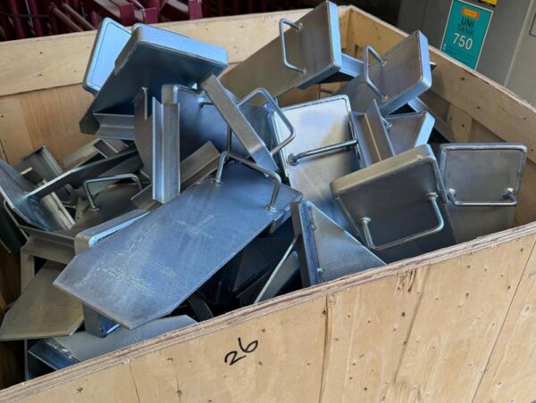 Heavy-duty galvanised Strongboy masonry supports stored in a timber crate for construction, lintel installation and wall support projects.